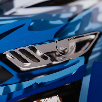 Close-up of a blue car model with a metallic grille