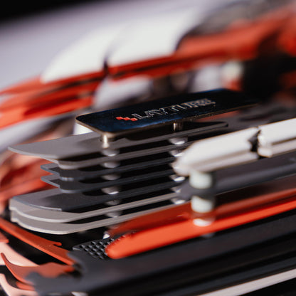 Close-up of a red car model with lots of metal connectors with a blurred background